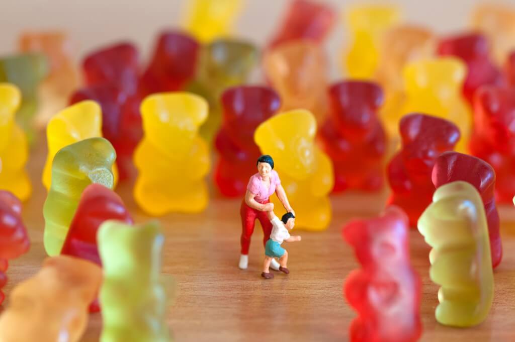 Gummy bear invasion. Harmful/ junk food concept